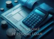 A calculator, monthly spending budget sheet, coins, and a pen symbolizing budgeting and financial planning for a low income personal loan.